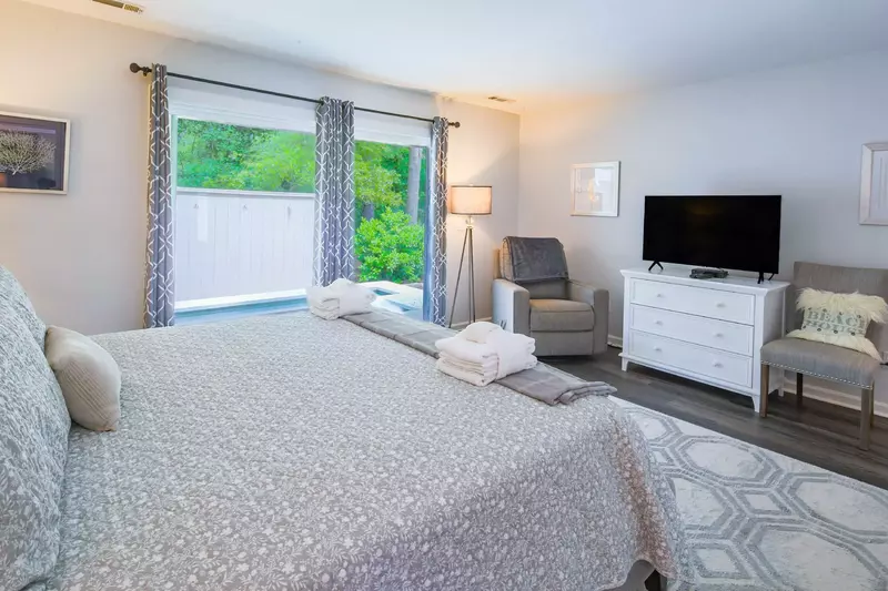 The master suite also features sliding door access to the private hot tub in the backyard.