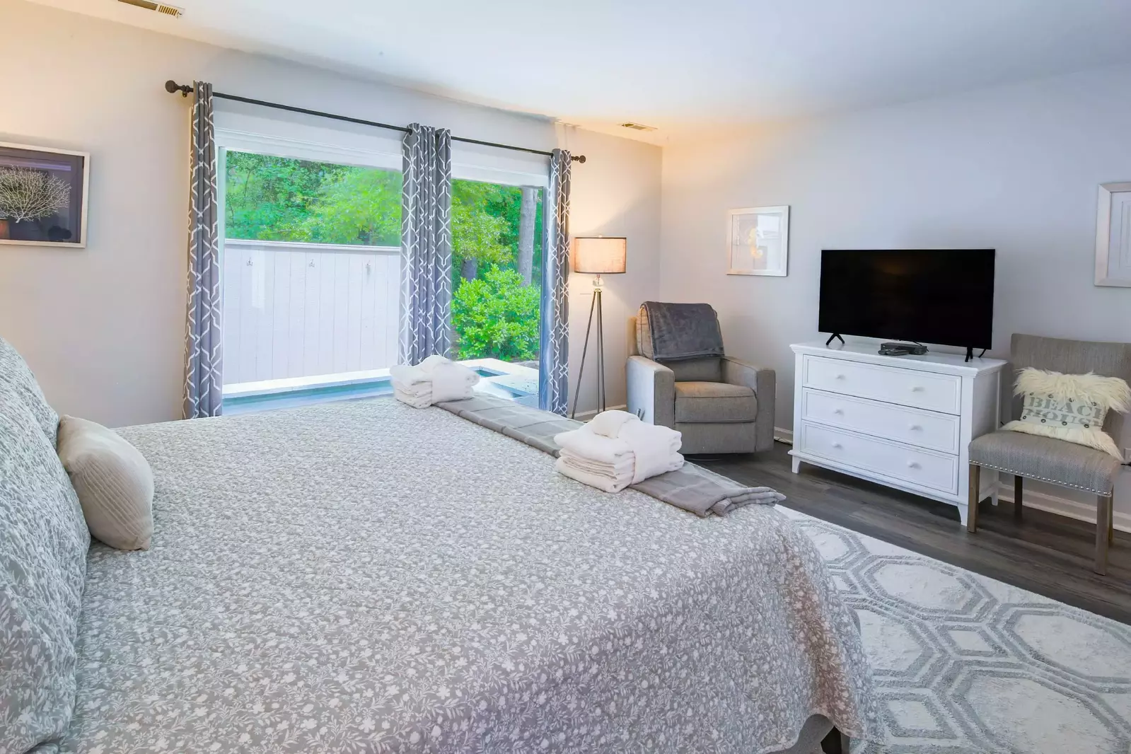 The master suite also features sliding door access to the private hot tub in the backyard.