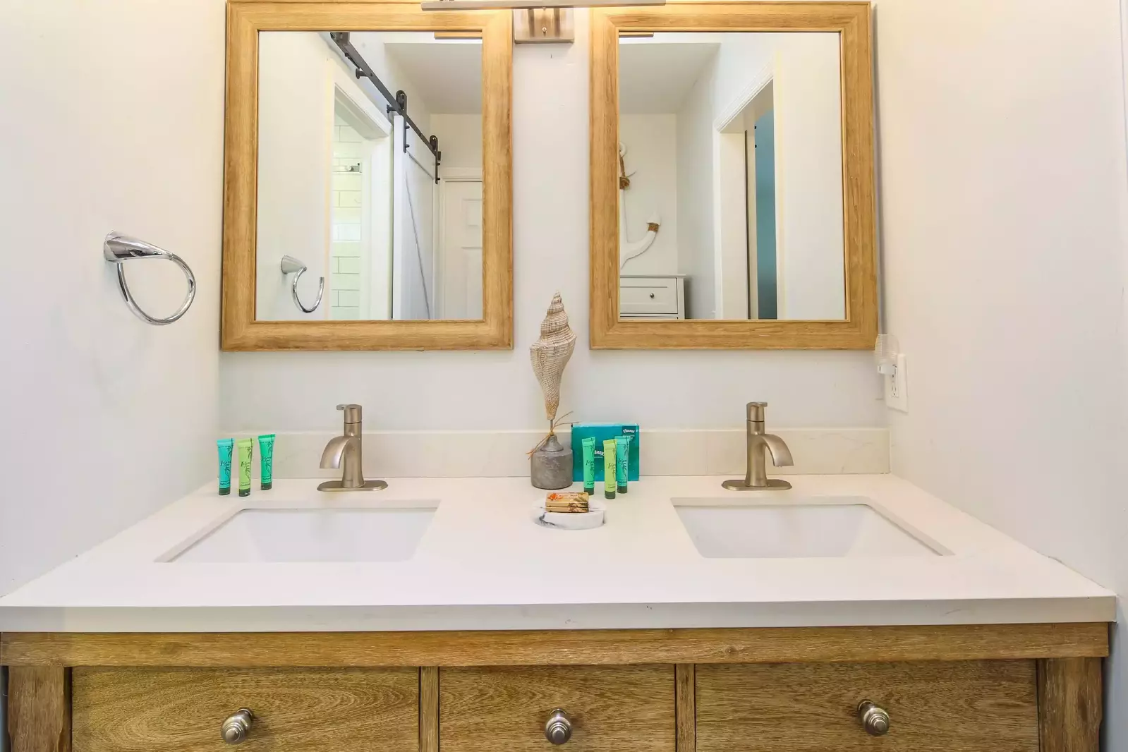 The en suite bathroom features a dual sink vanity.