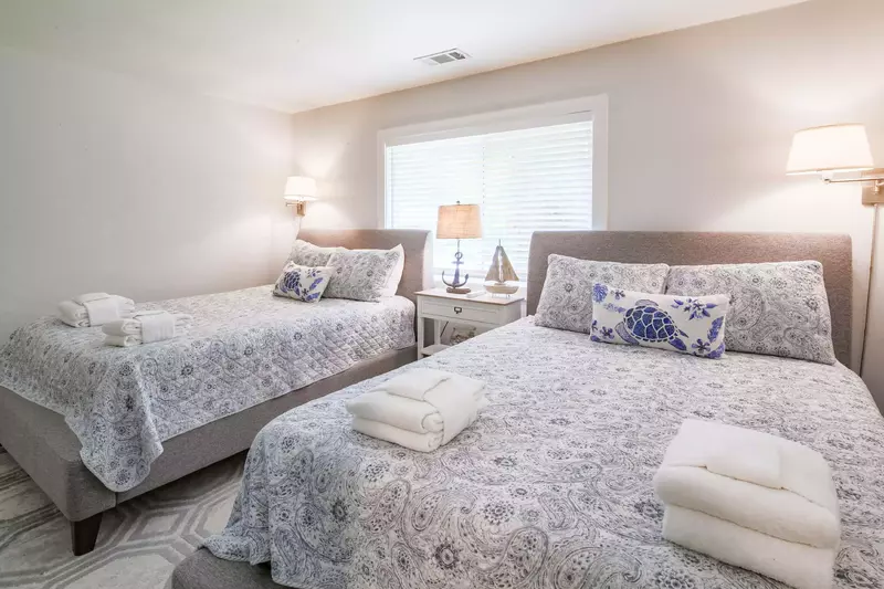 The queen guest bedroom features two queen beds.
