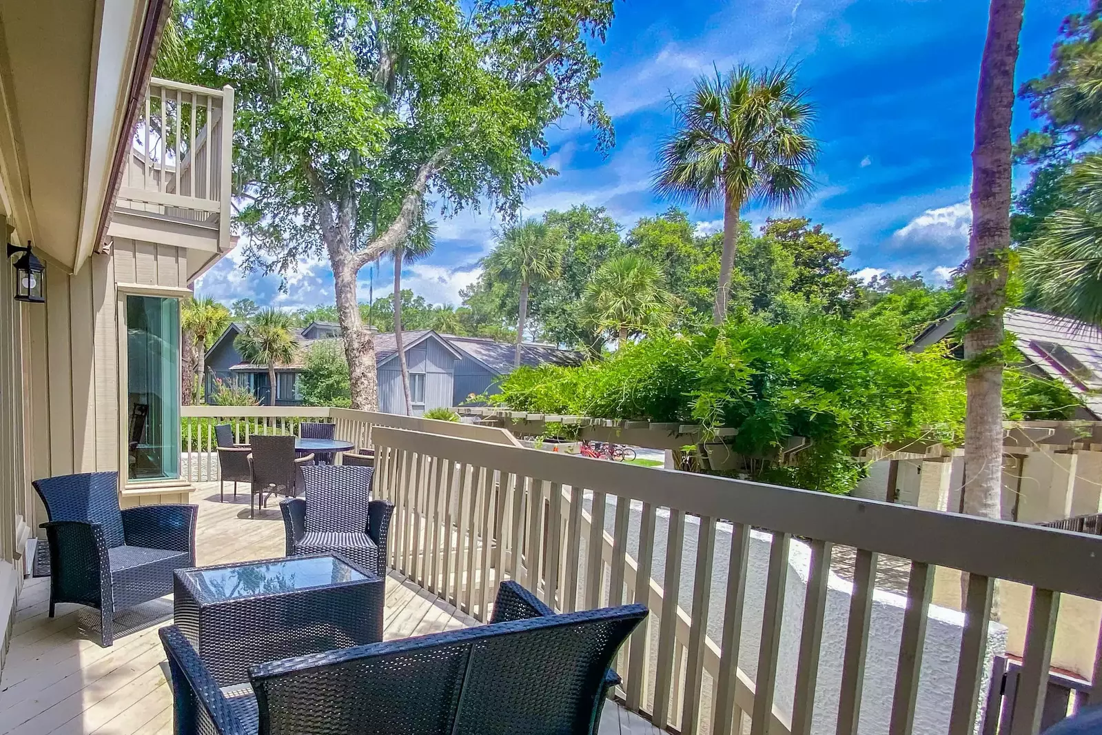 Return from the pool or beach and relax on the villa's large back deck.
