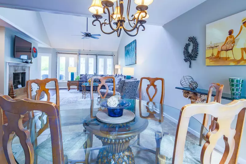 When you enter the home's front door, you'll find the dining area and living room.