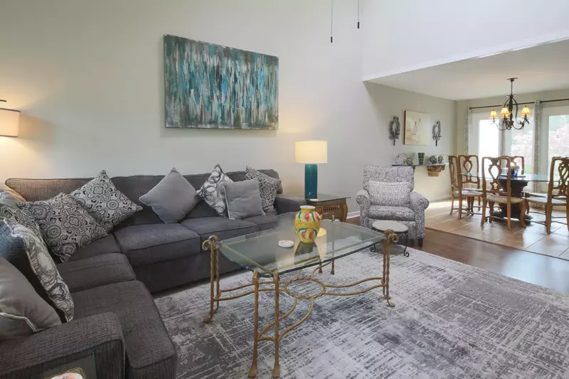 The living room features vaulted ceilings and a comfortable seating area.