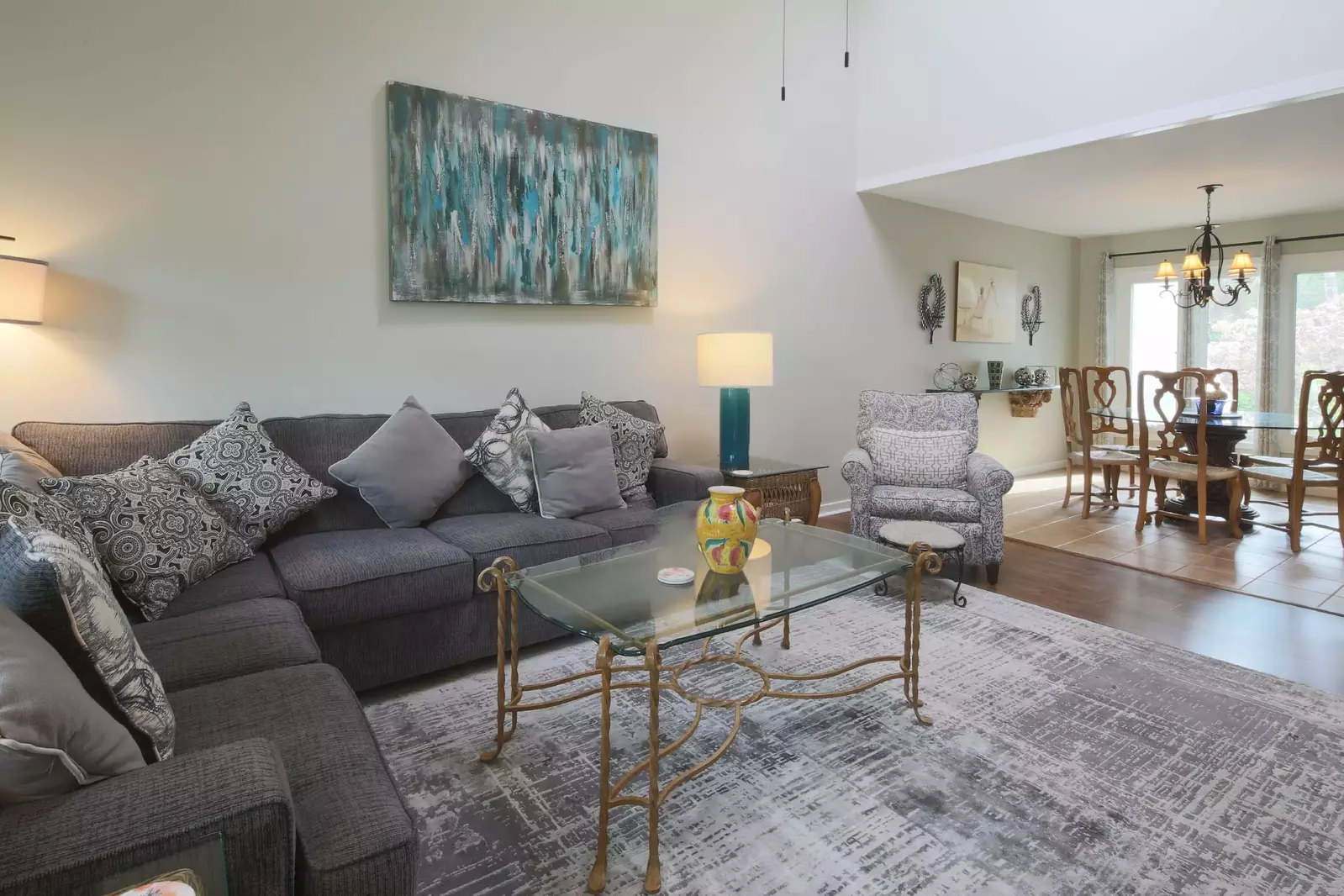 The living room features vaulted ceilings and a comfortable seating area.