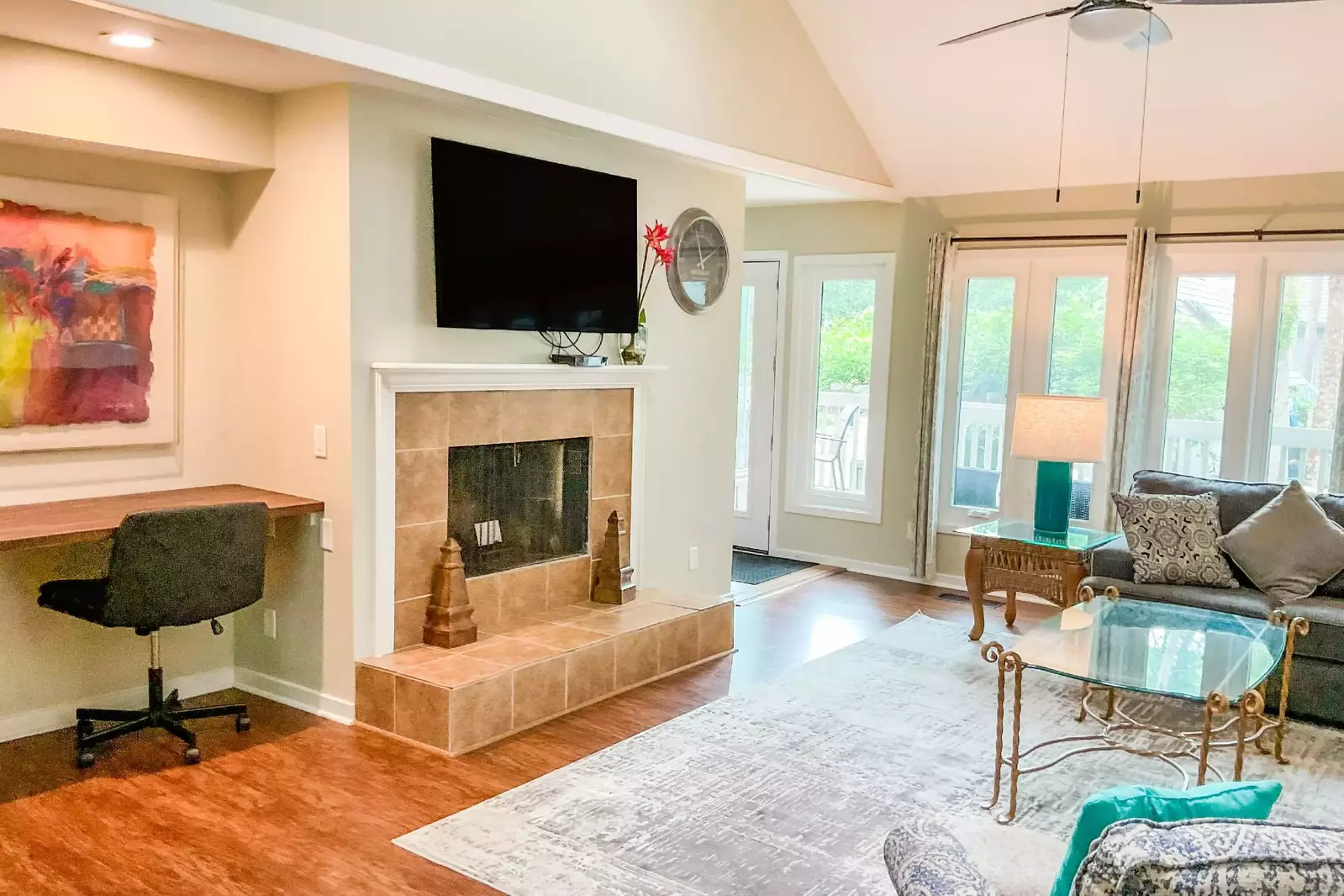 The doors in between the living room and kitchen lead to the spacious back deck.