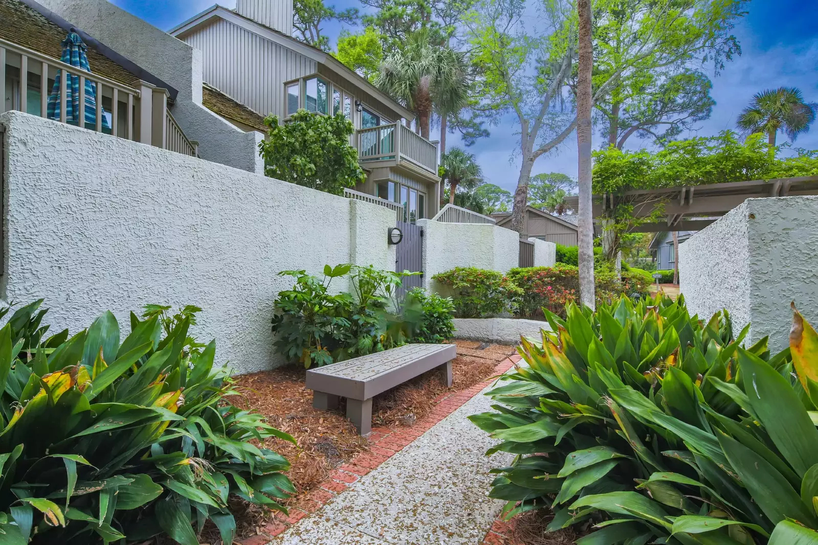 Take the stairs from the back porch down to this path to the community pool.