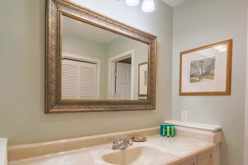 The en suite bathroom has two vanities.