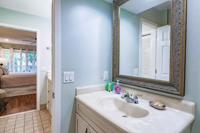The first vanity is near the bedroom and the second vanity is in a separate room.