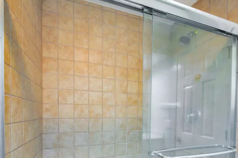 The master suite also has a tiled, walk-in shower.