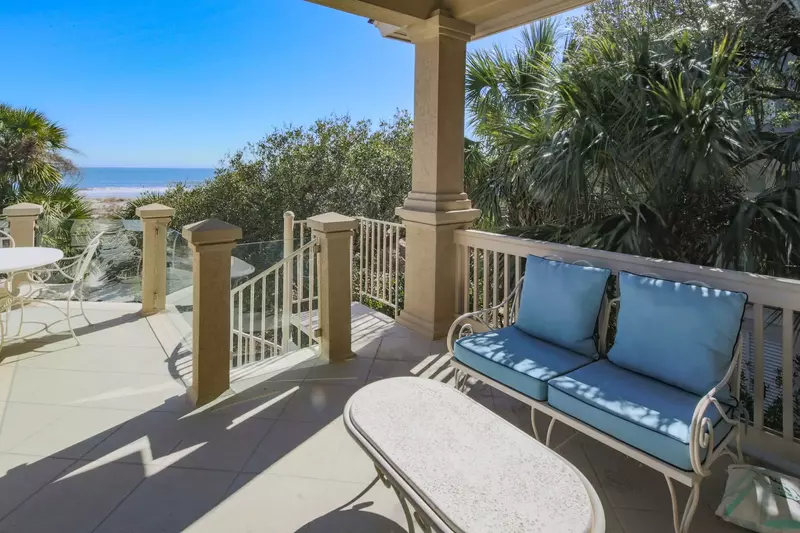 Step outside from the master suite to find this covered porch.