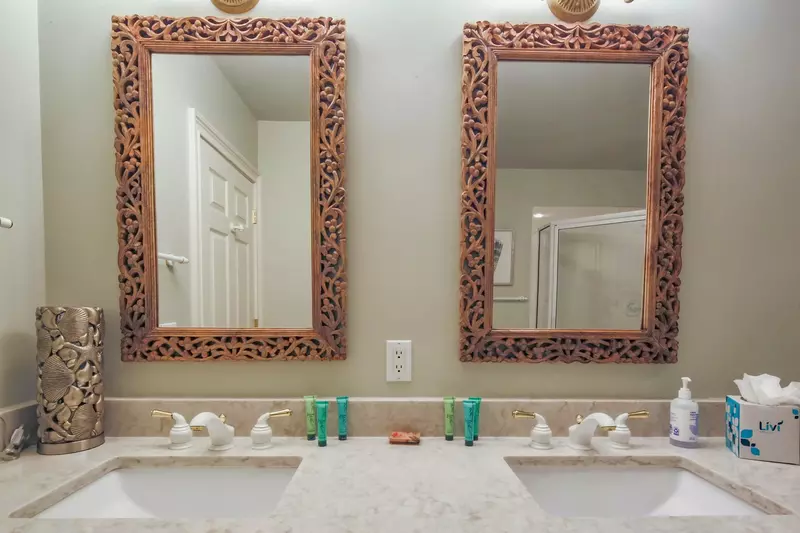 This en suite bathroom features a double sink vanity.