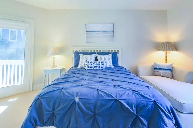 This guest suite also features a queen bed, chaise sofa and access to the back porch & pool area.