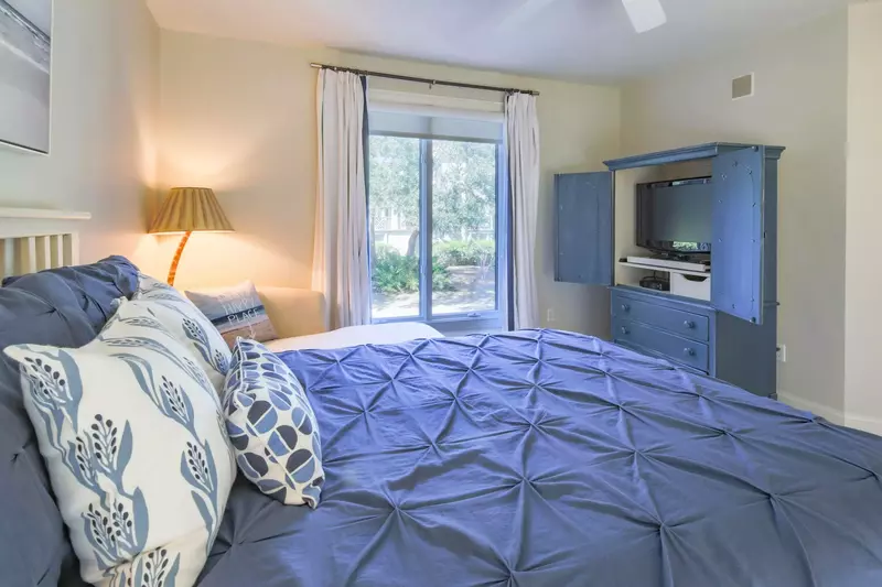 This bedroom also has an armoire with TV.