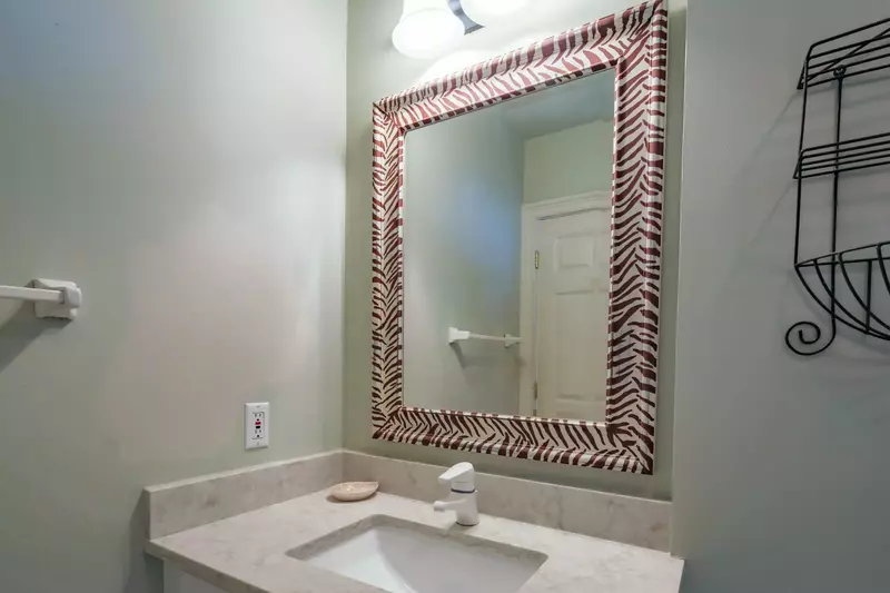 This en suite bathroom features vanity and a shower/tub combo.