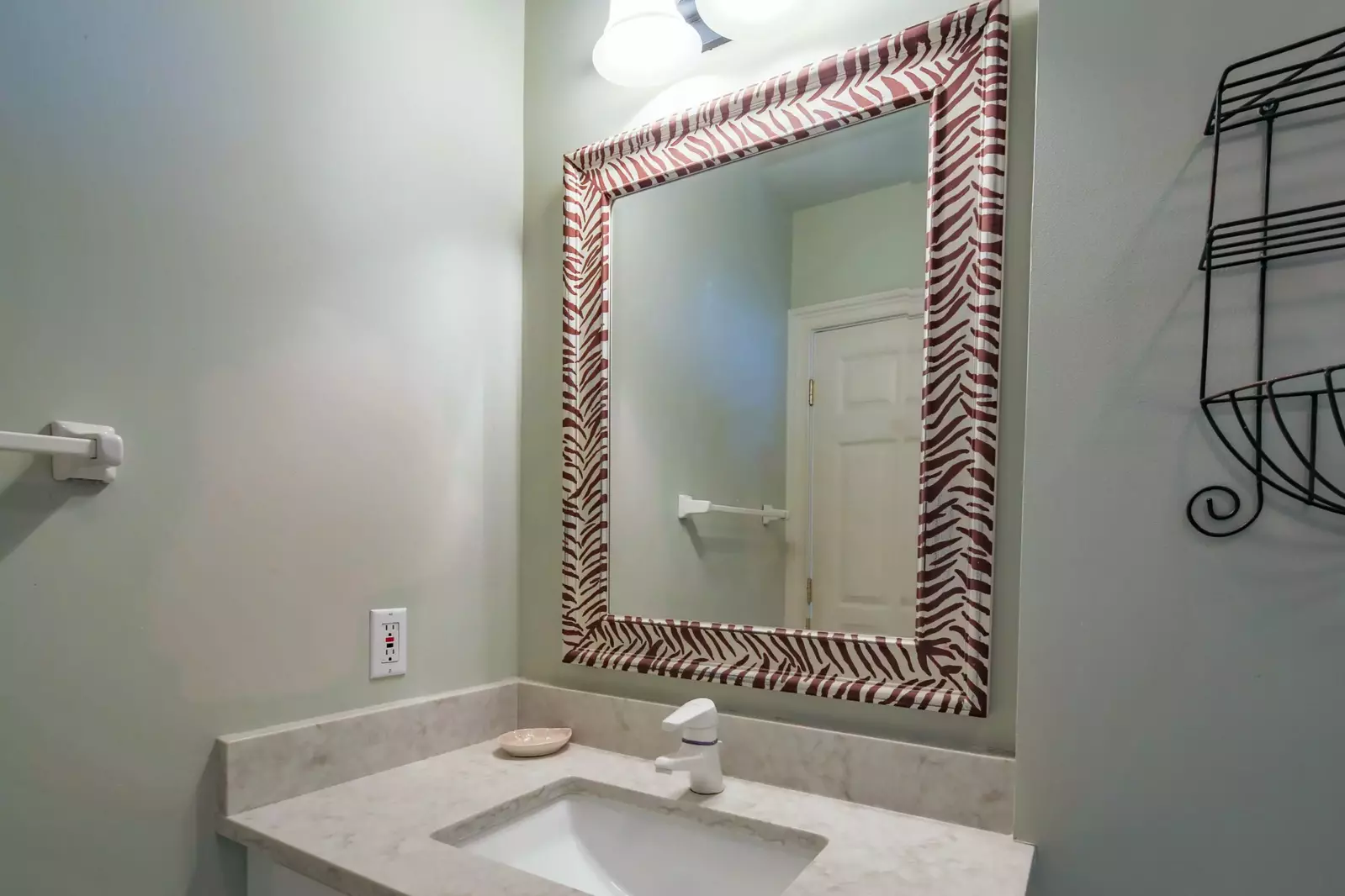 This en suite bathroom features vanity and a shower/tub combo.