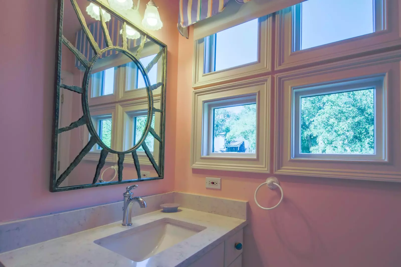 This en suite bathroom features a spacious vanity and a shower/tub combo.
