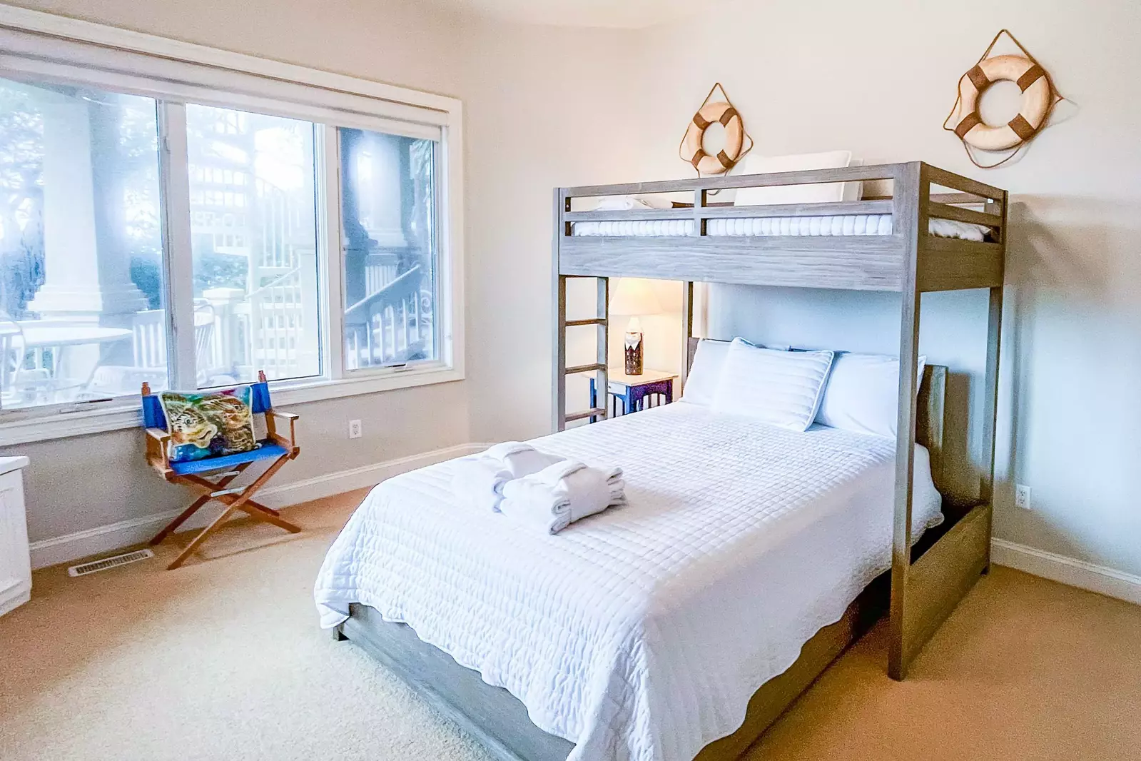 The bunk suite features a queen bed on the bottom bunk and a twin bed on the top bunk.