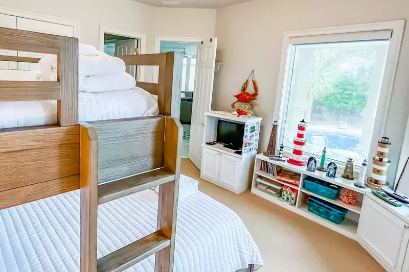 This guest suite also features pool views, a TV and collection of lighthouses.