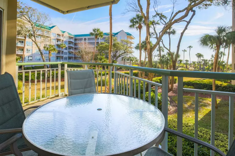The covered balcony overlooks the Windsor II garden and has limited ocean views.