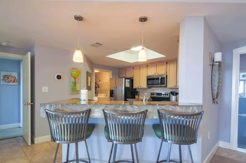There are 3 stools at the kitchen counter.
