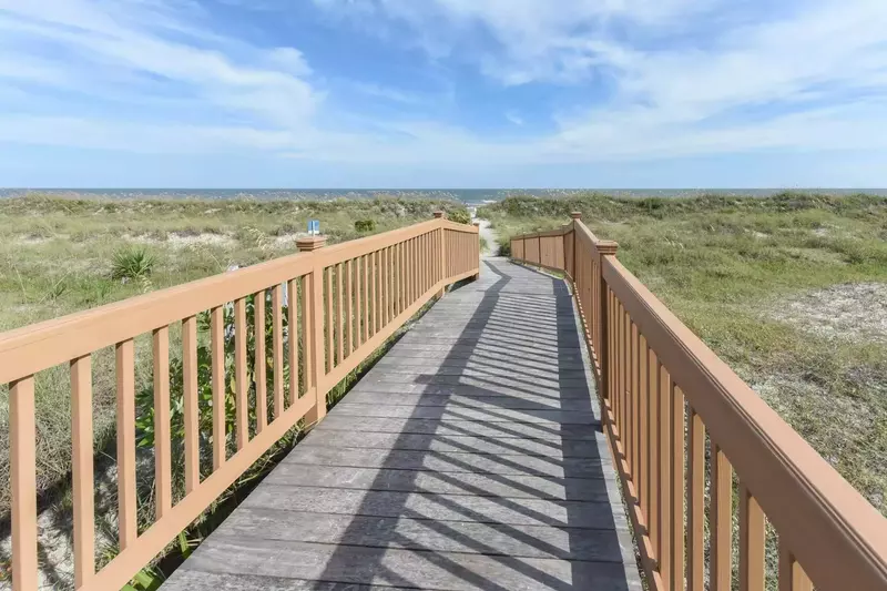 Just follow this boardwalk, which is accessible from the community pool area, to the beach!