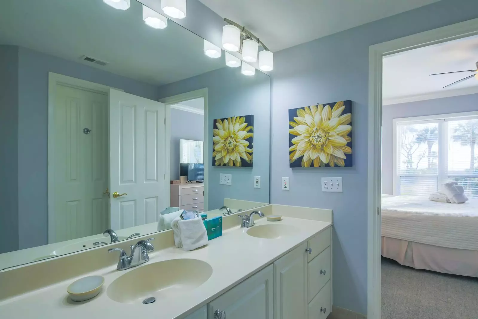 The en suite bathroom for the master suite features a spacious, double sink vanity.