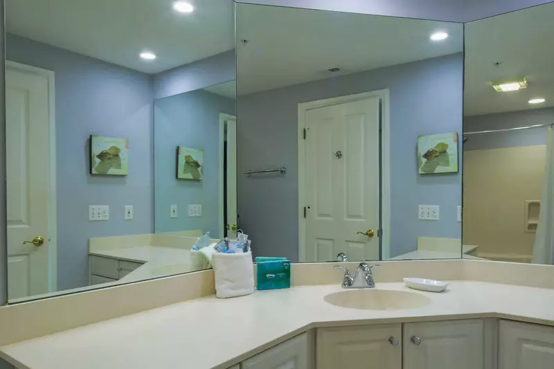The en suite bathroom for the guest suite features a large vanity.