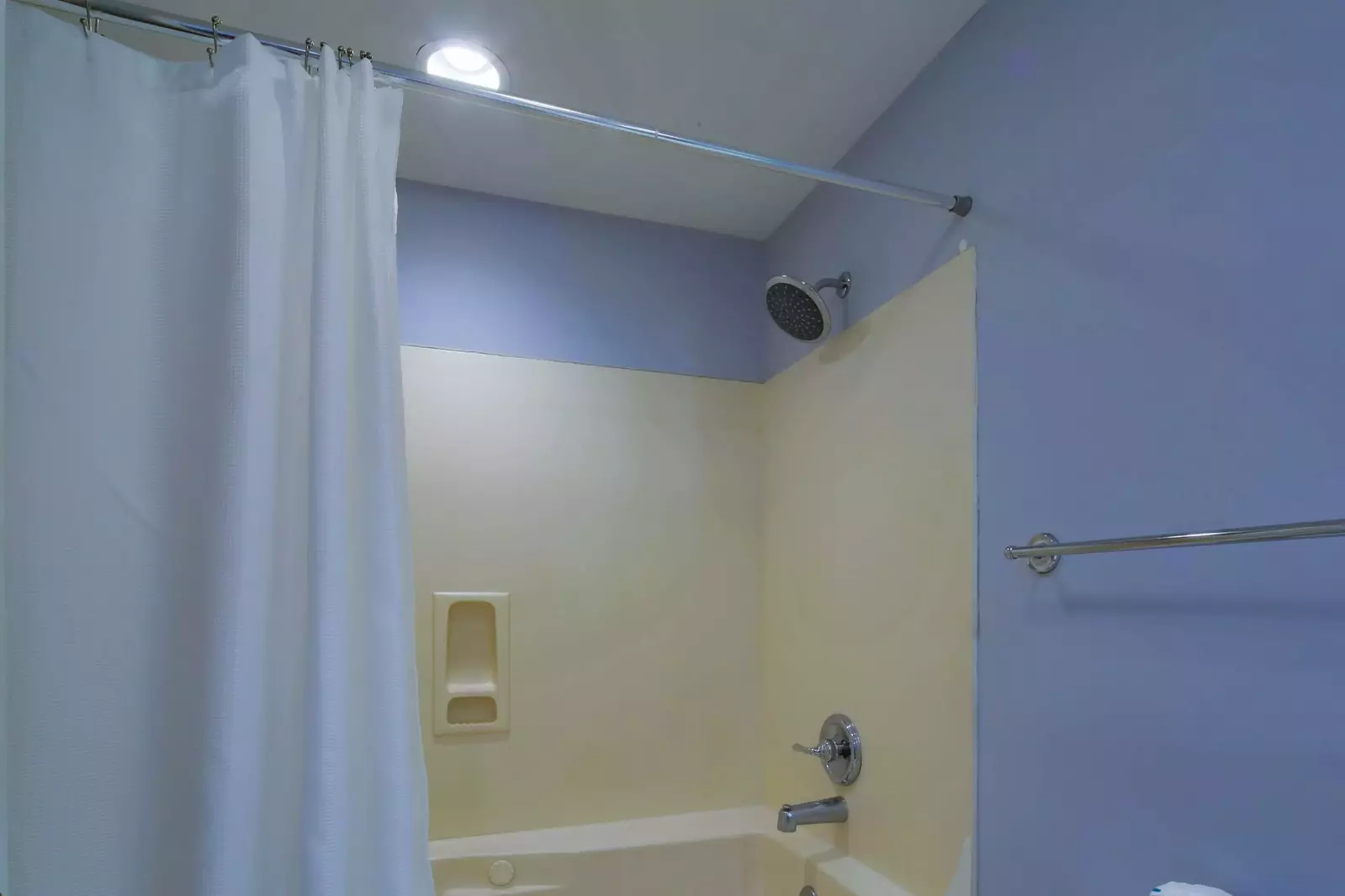 The en suite bathroom for the guest suite also has a shower/tub combo.