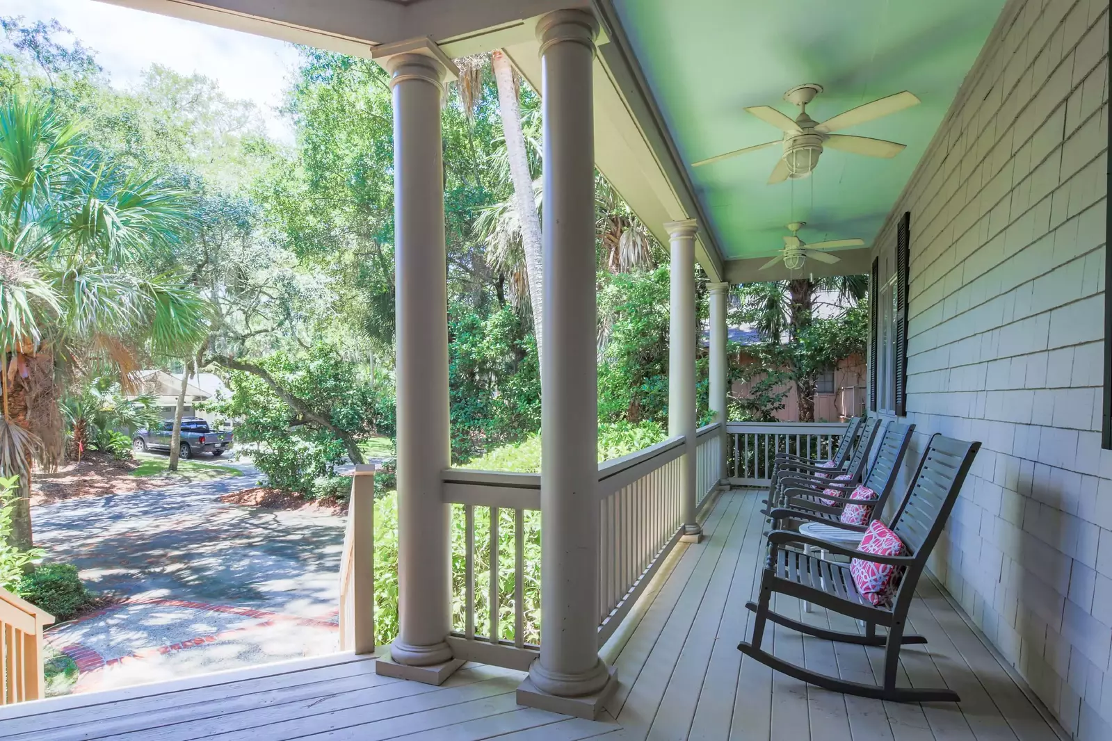 Four rocking chairs and two ceiling fans on the porch greet you as you arrive to this wondeful home.