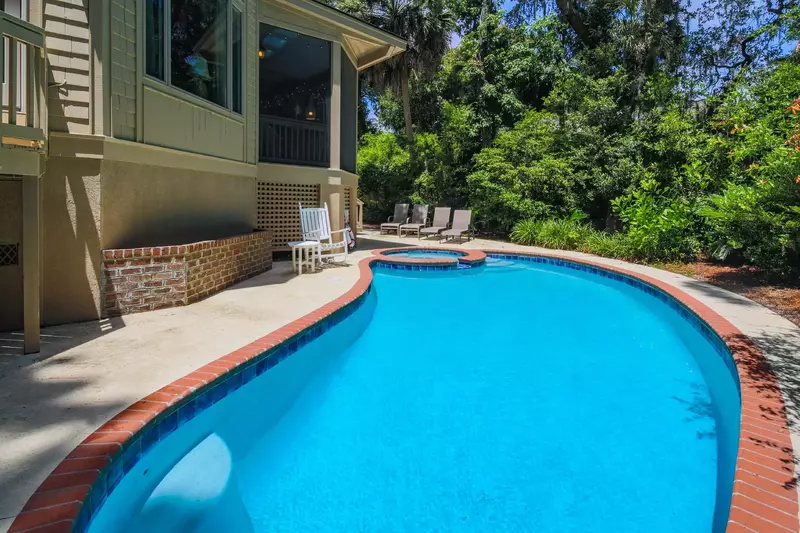 Relax and unwind in the private pool and spa behind the home.