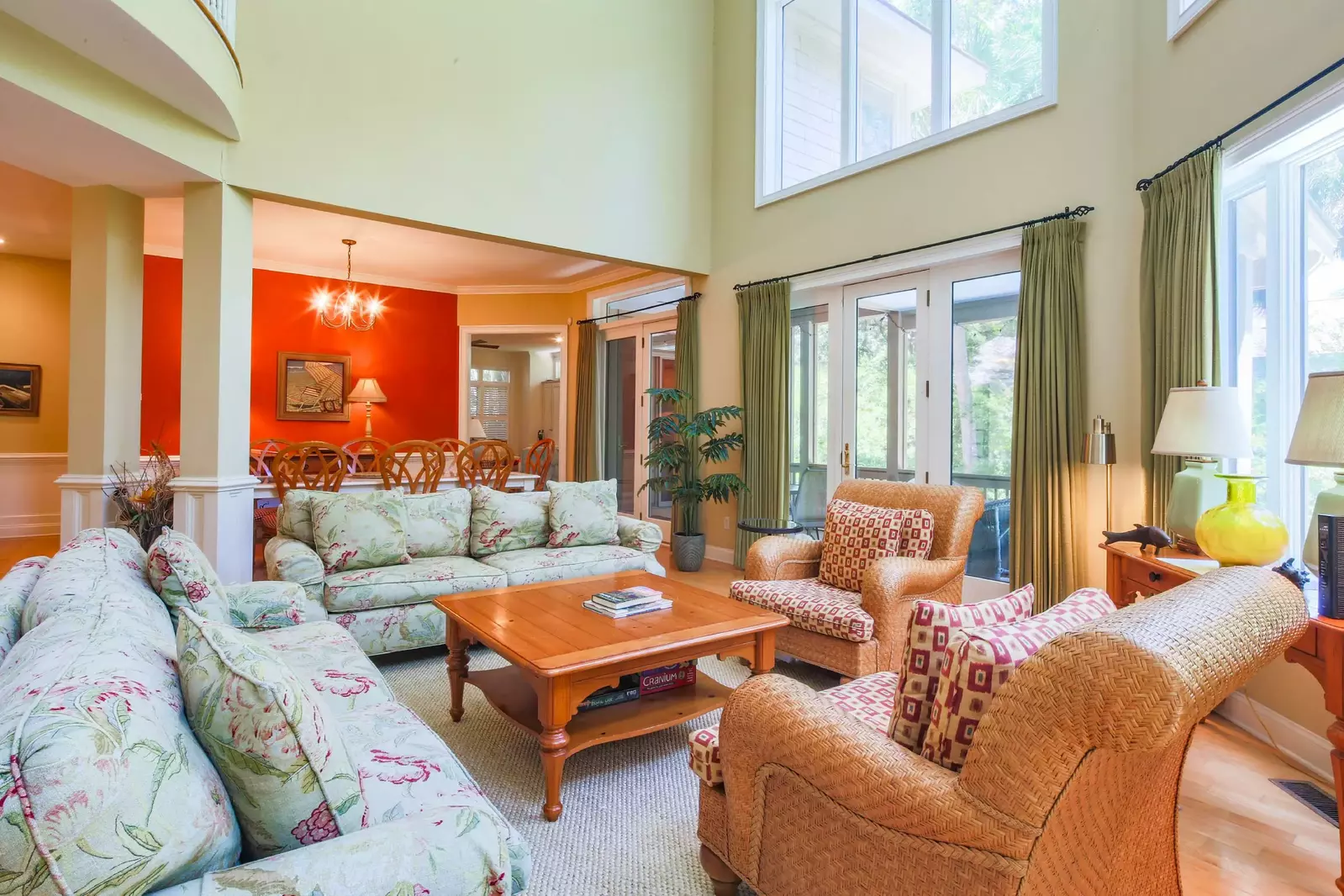 The living room opens into the dining room and screened porch.