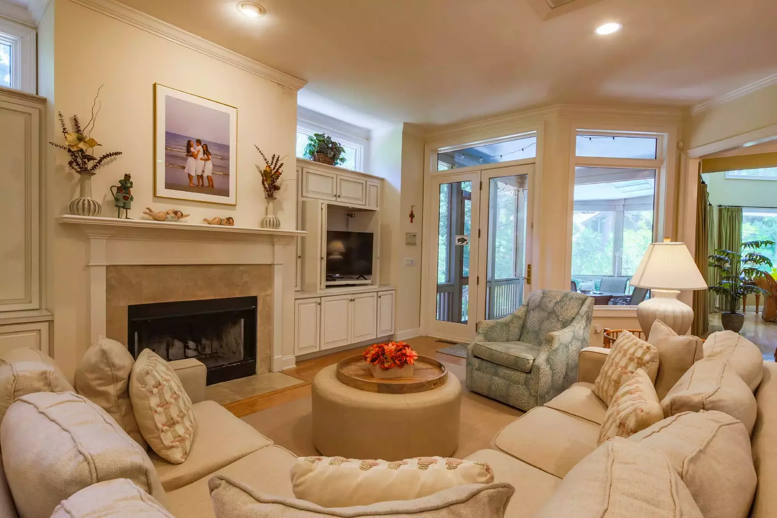 This lovely den is located in between the kitchen and screened porch.