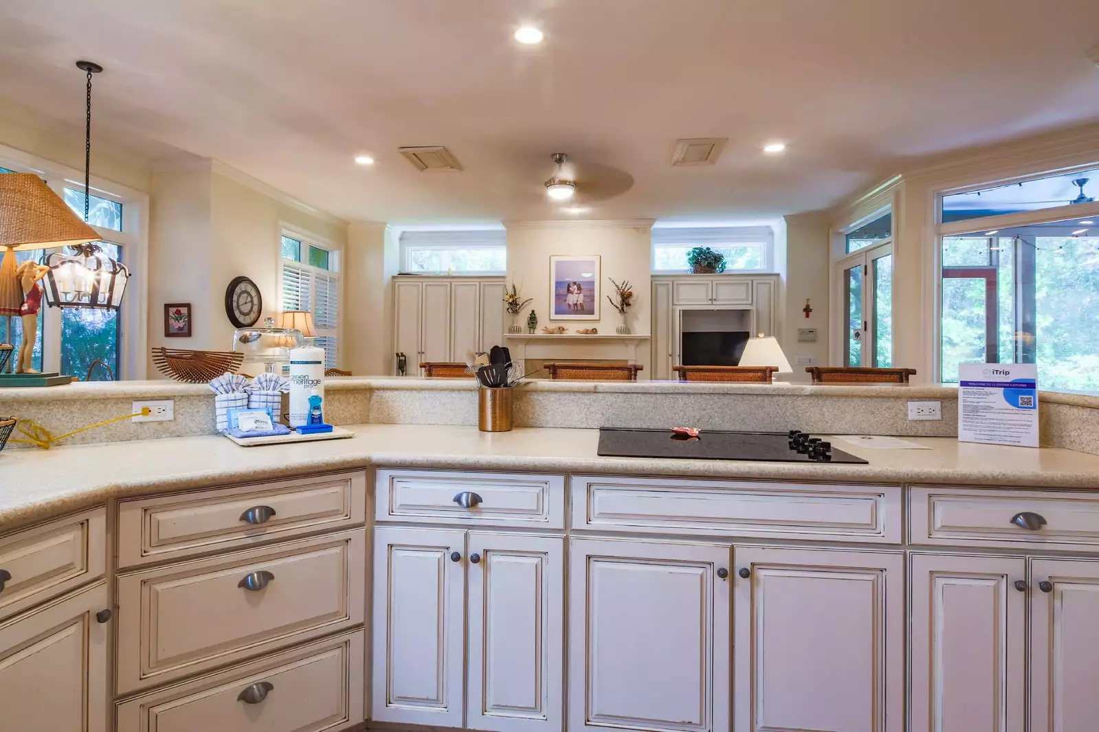 The open floor plan layout between the kitchen and den make it easy to interact with your guests.