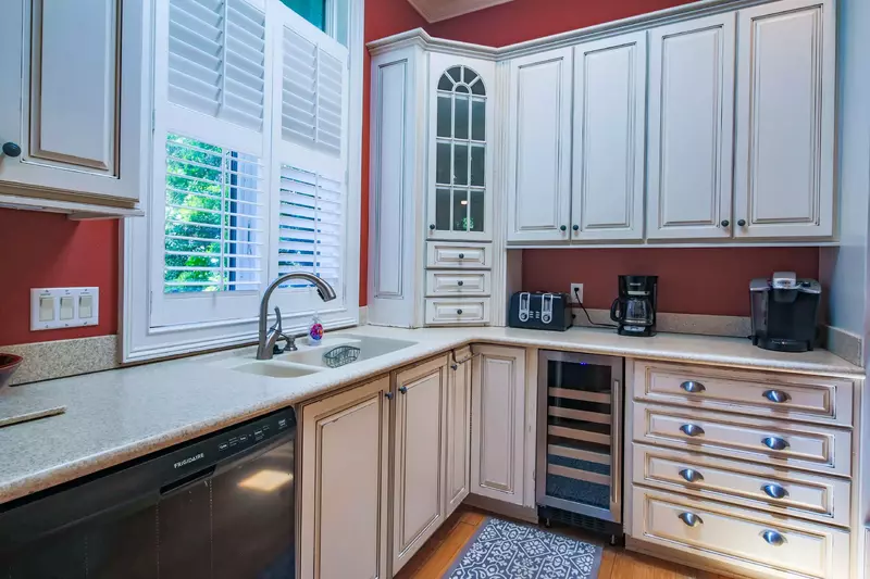The kitchen features a dishwasher, toaster, drip coffee maker and keurig.