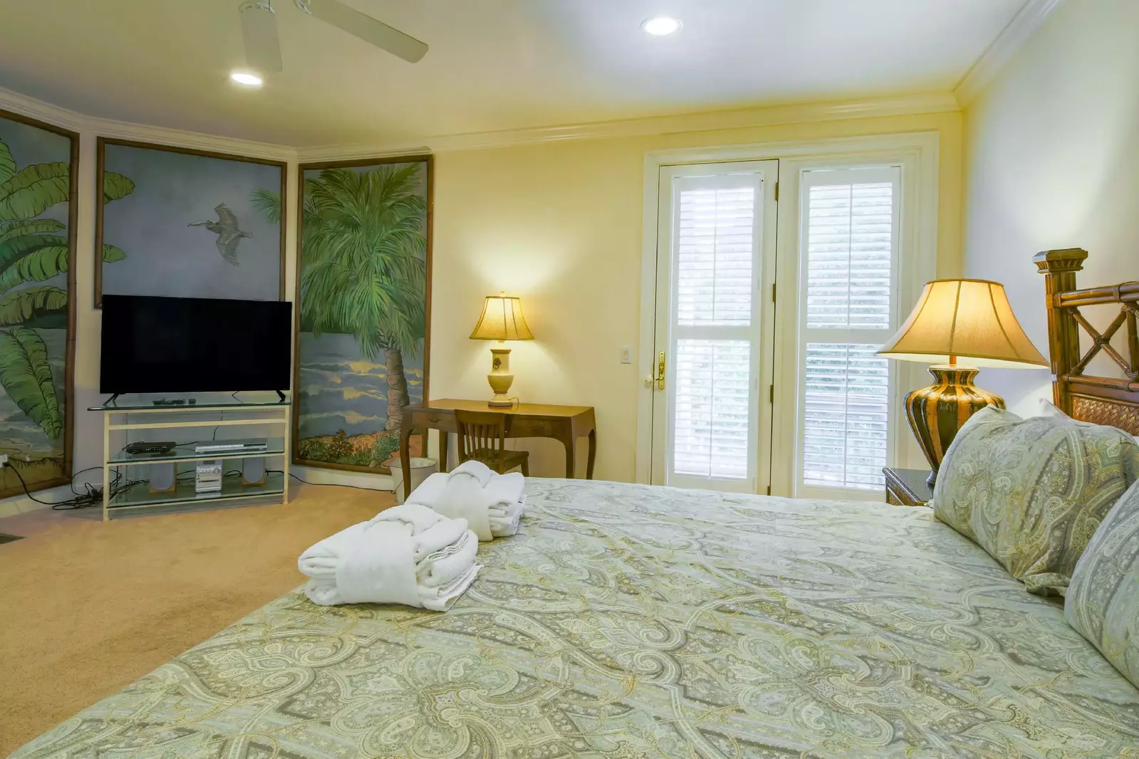 The master suite also features a large screen TV, access to the back deck and a desk.