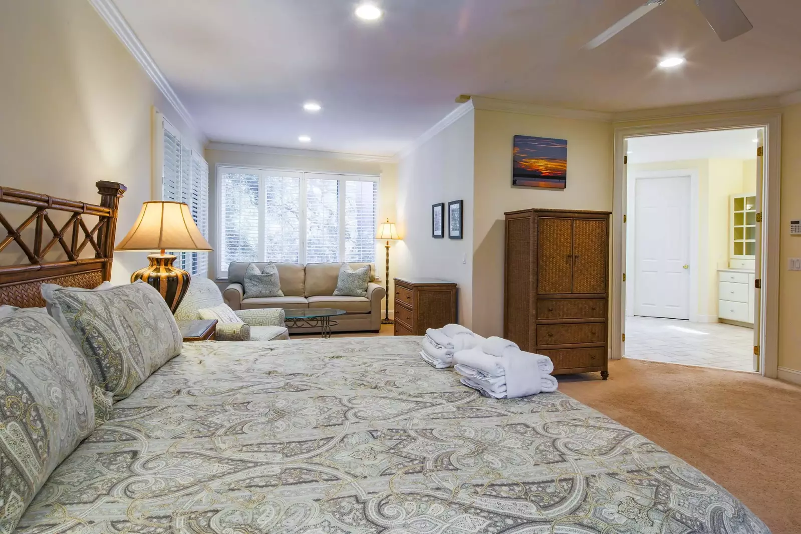 The master suite opens into its own seating area and en suite bathroom.