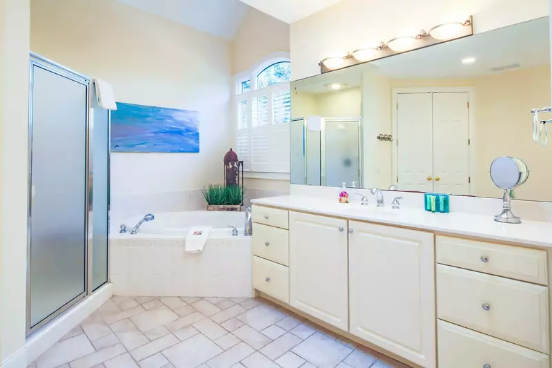 There is a walk-in shower and a soaking tub.