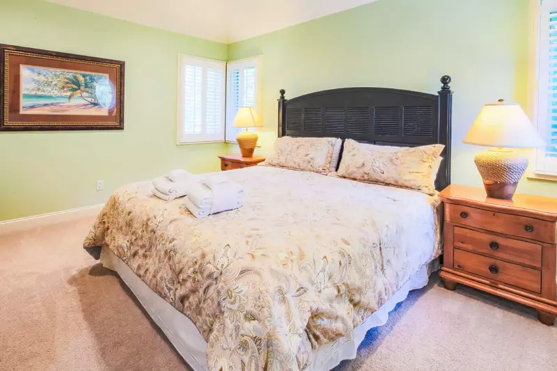 The second master suite, which is located on the top floor, features a king bed.
