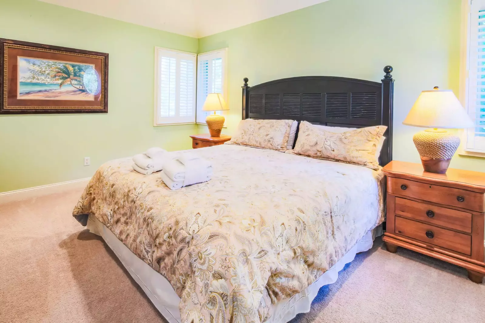 The second master suite, which is located on the top floor, features a king bed.