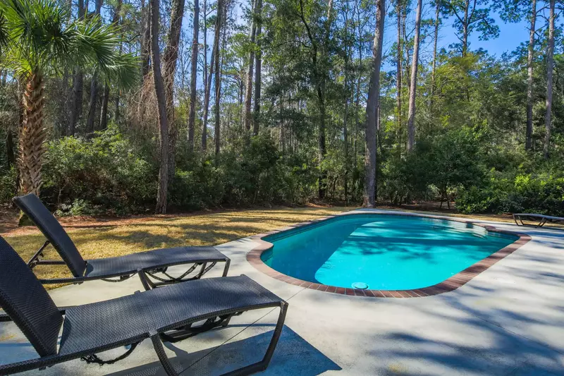 The trees provide both privacy and partial shade for your time at the pool.