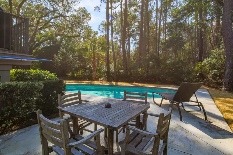 Dine al fresco at this poolside outdoor table.