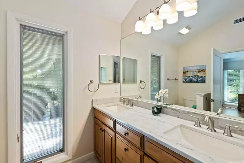 The master bathroom features a spacious, dual-sink vanity.