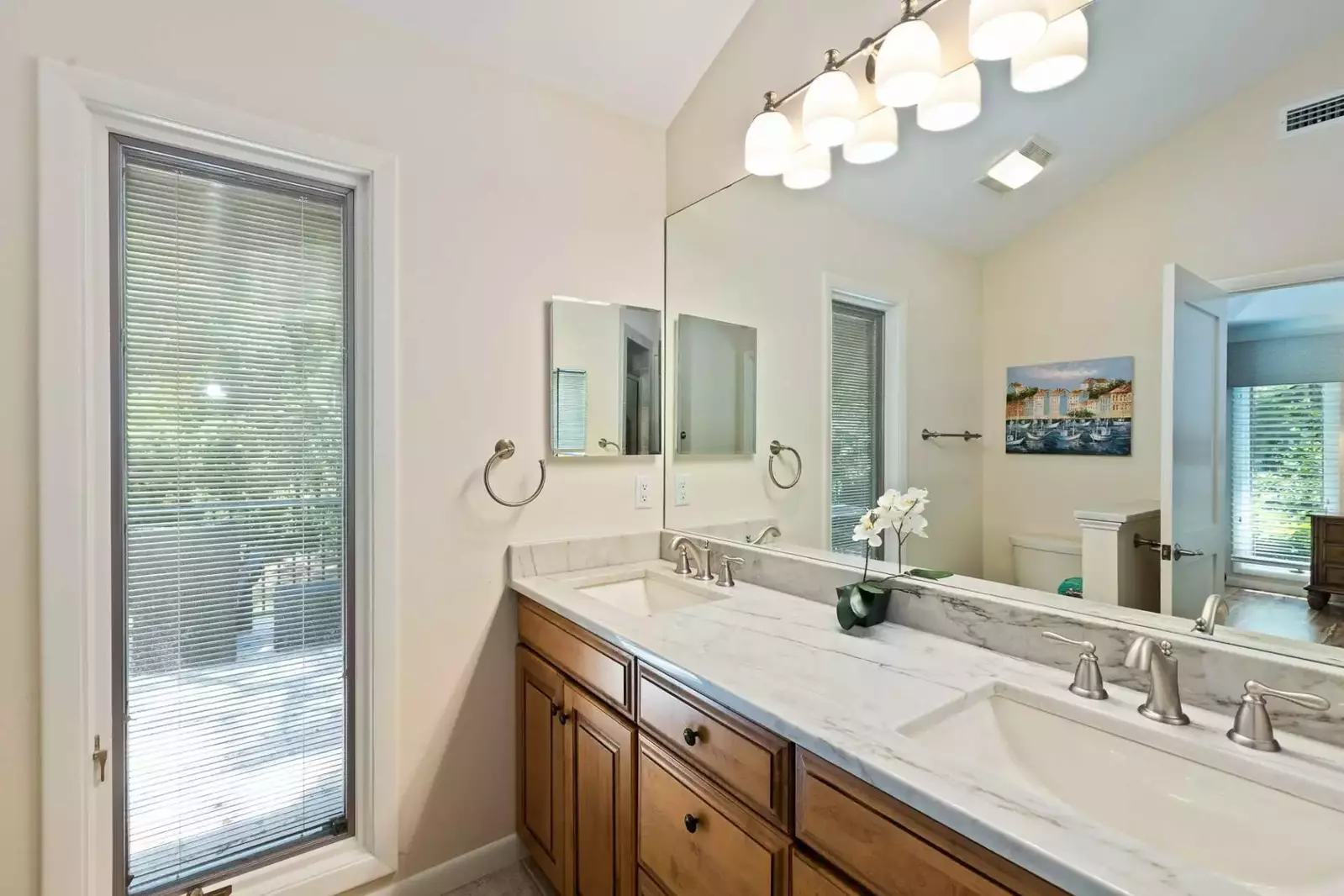 The master bathroom features a spacious, dual-sink vanity.