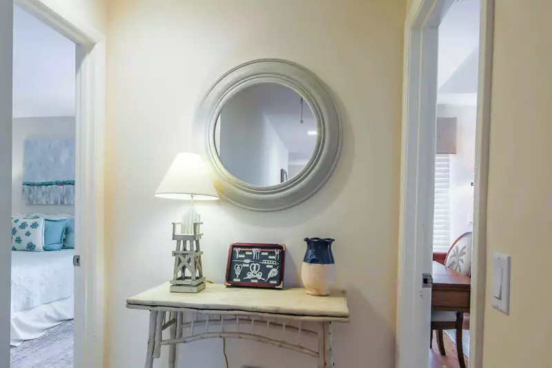 The home's two master suites are on opposite sides of this hallway.