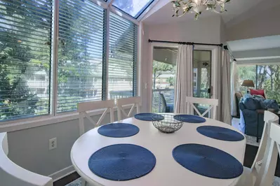 This second floor villa features lagoon views and a covered balcony.