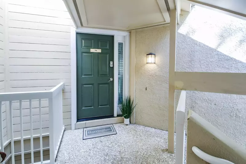 Take the exterior staircase from the parking area & sidewalk to the second floor.