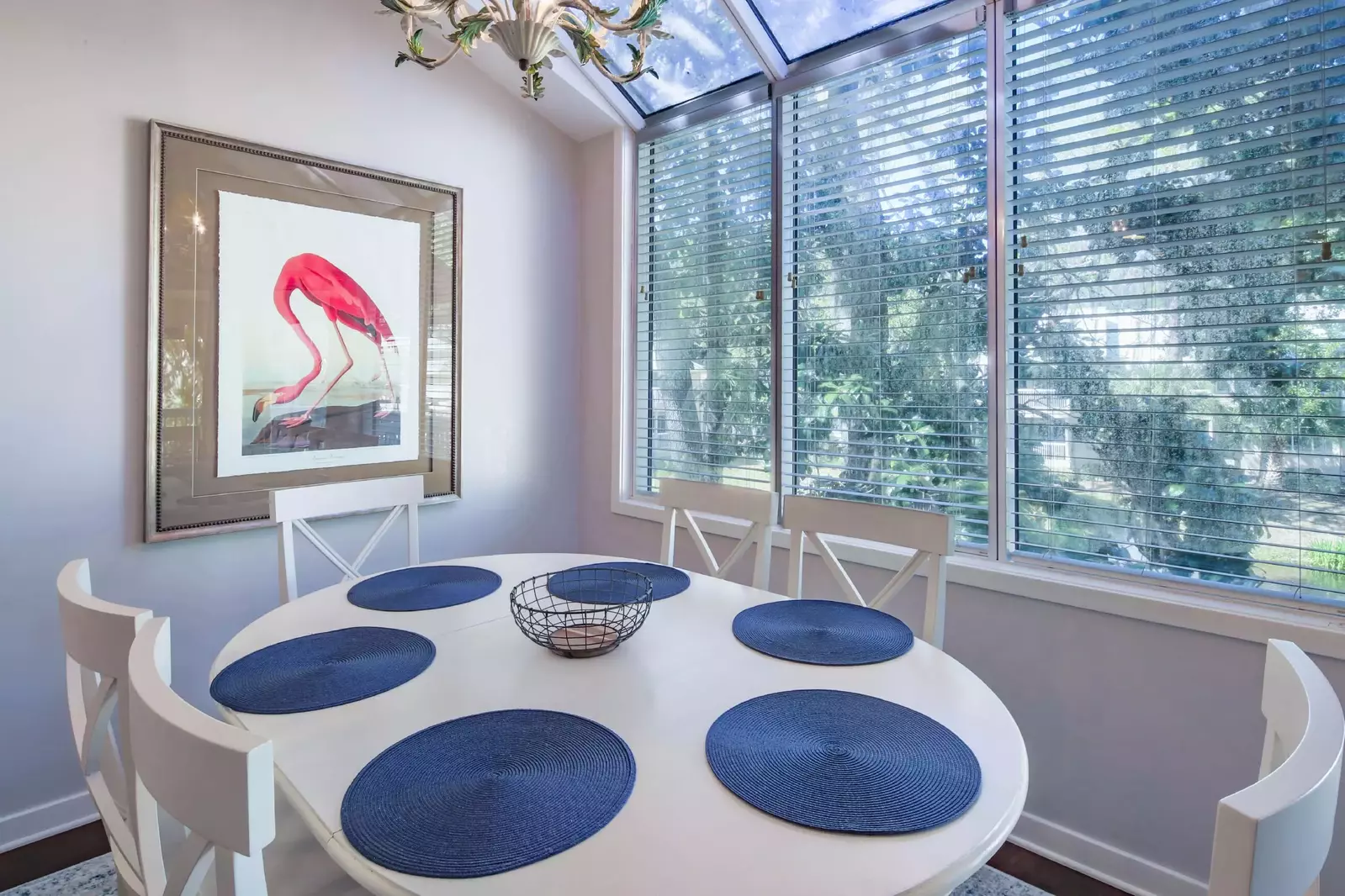 The dining table seats 6 and has lagoon & garden views.