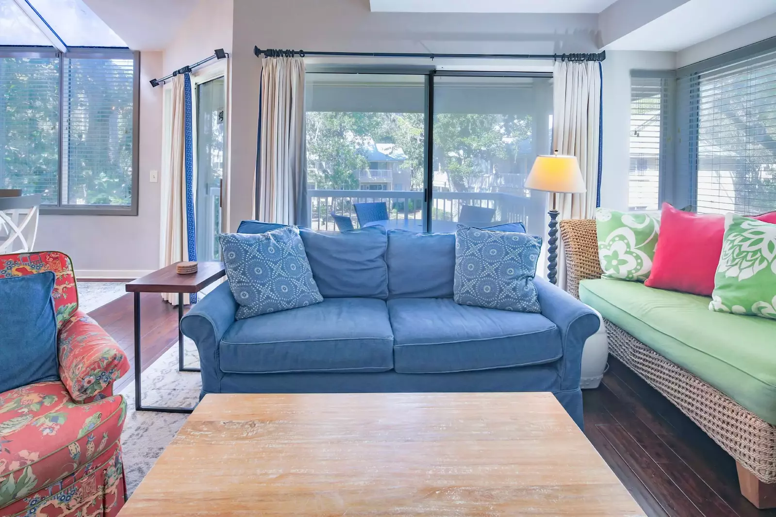 You can access the covered balcony through the sliding glass doors in the living room & dining area.