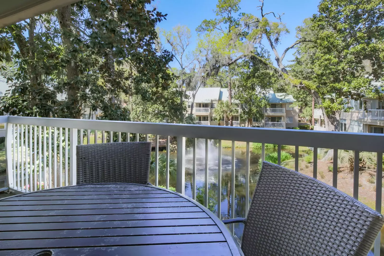 The covered balcony also has views of the lagoon and garden below.