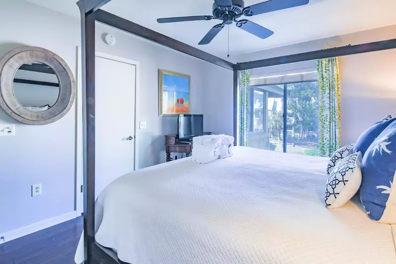 The master suite also has a flat screen TV, ceiling fan and en suite bathroom.